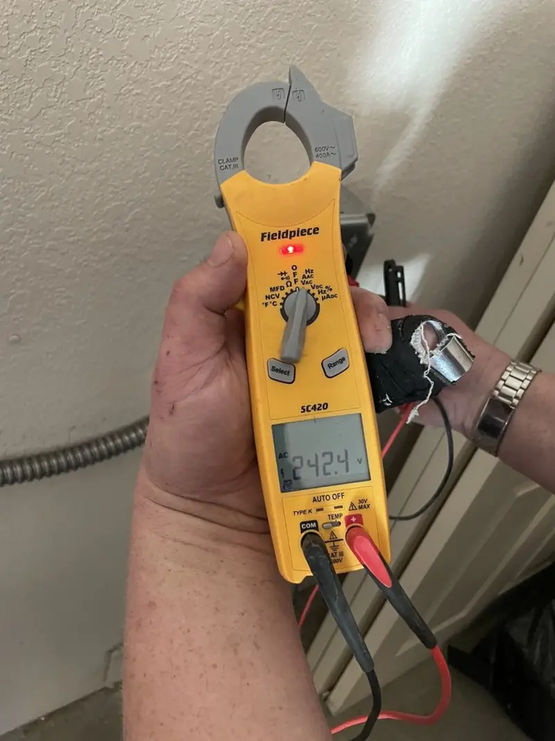 Voltage testing with clamp meter during Outlet Installation in Altamont